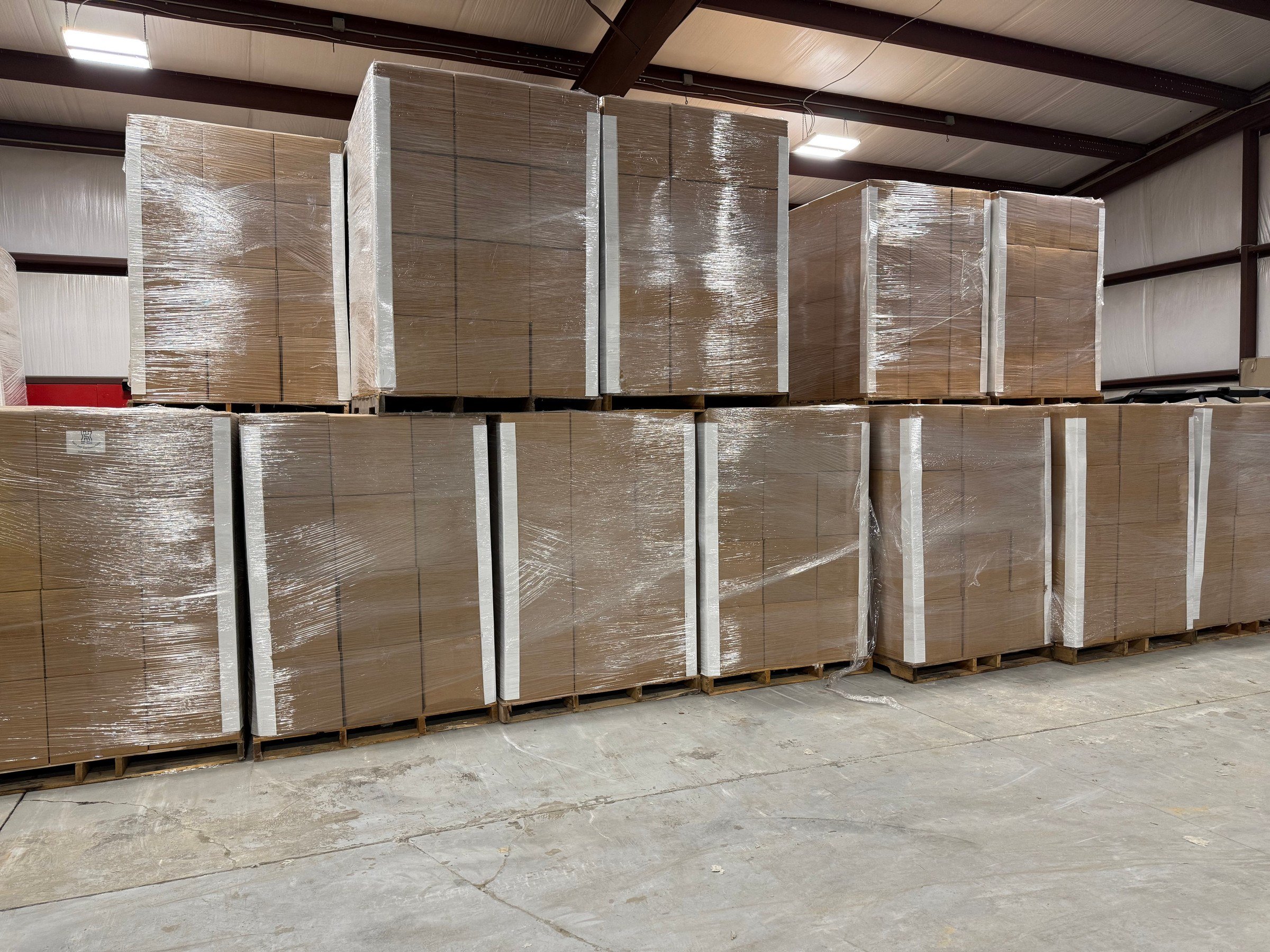 Pallets of Fortress Concrete Fiber stacked in a warehouse