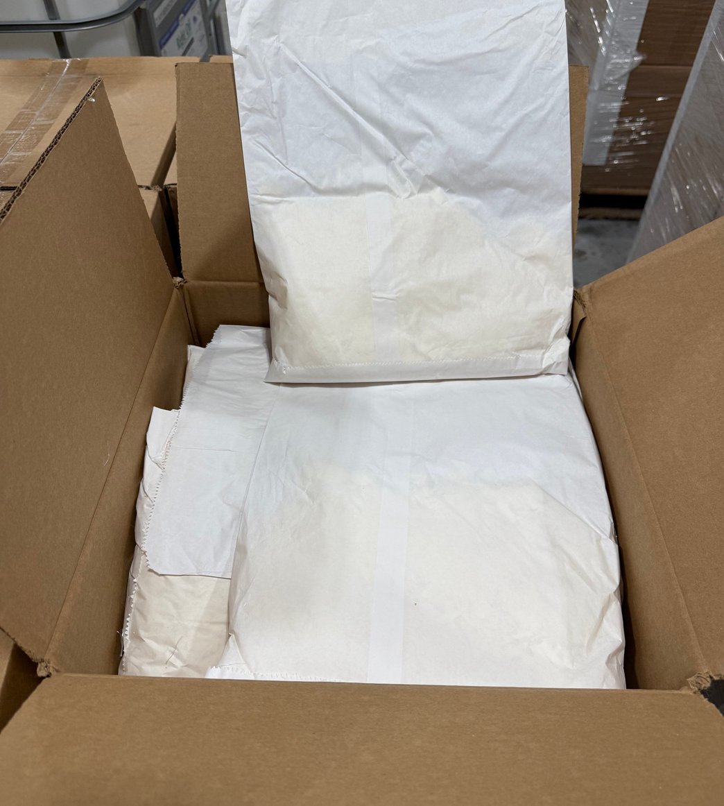 An open box of 1 lb water-soluble Fortress fiber bags